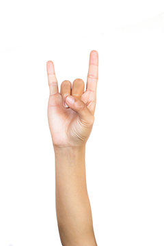 A front of female hand making horns gesture or Rocker symbol on white background.