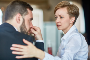 Helpful colleague comforting frustrated businessman in trouble