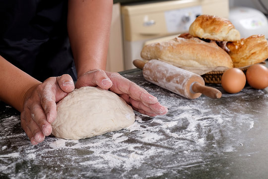 Hands working with dough preparation recipe bread