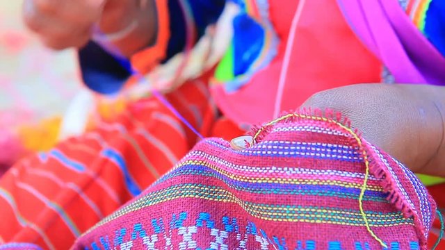 thai dara-ang domestic hill tribe in chiangmai northern of thailand make a clothing hand craft