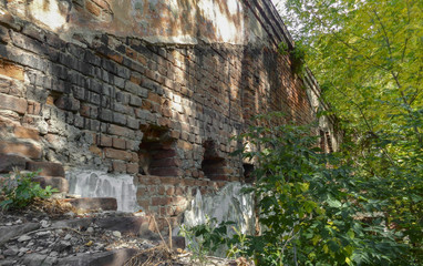 Fragment of the wall of a very old building. Old architecture. Abandoned building. Old city. Historical heritage. Historical architecture