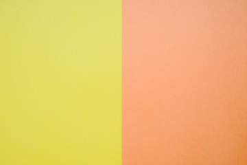 Texture background of fashion pastel colors: yellow and orange in minimal concept. Flat lay, Top view.