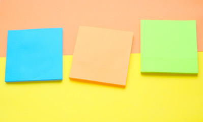 colorful stick note on yellow with a coral background.Flat.Paper for writing ideas.Memo.