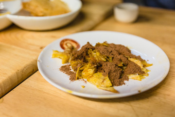 Fried roti topping with condense milk and chocolate power at the dessert cafe in Chiang Mai, Thailand.