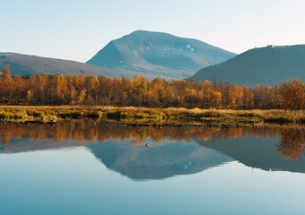 The beautiful lake in autumn paints. Tromso. Prestvann 