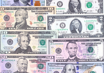 Abstract american dollar bills of different denomination background.