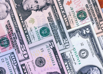 Abstract american dollar bills of different denomination background.