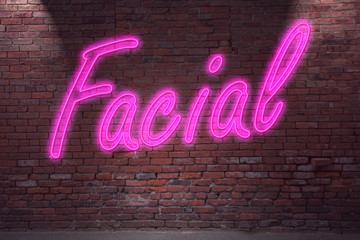 Leuchtreklame Facial an Ziegelsteinmauer