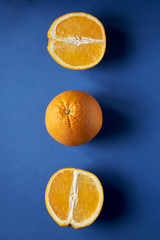Juicy ripe oranges on a blue background