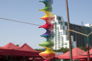 Colorful spiral hanging with thread and in open