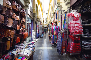 Alcaiceria Market in Granada, Spain. Narrow streets filled with shops called Alcaiceria - obrazy, fototapety, plakaty