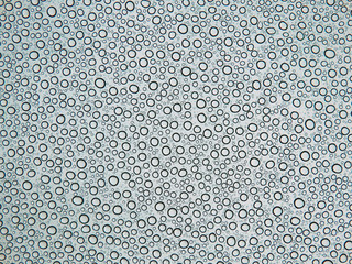 color macro photography of rain drops on glass, abstract detail water texture