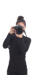 Woman photographer takes images with dslr camera in studio on white background. Asian woman use camera.