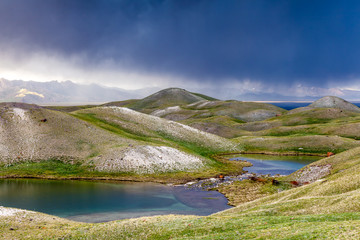 View of Tulpar Kul lake in Kyrgyzstan during the storm