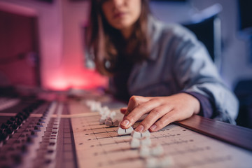Woman hands working on music mixer