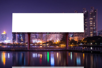 Blank billboard with urban and lake in the night - can advertisement for display or montage product or business