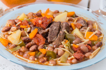 Brown beans with meat and carrot
