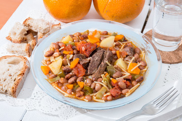 Brown beans with meat and carrot
