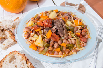 Brown beans with meat and carrot