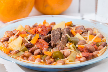 Brown beans with meat and carrot