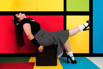 Pinup girl in pop art backdrop