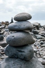 Obraz na płótnie Canvas Balanced stones on beach