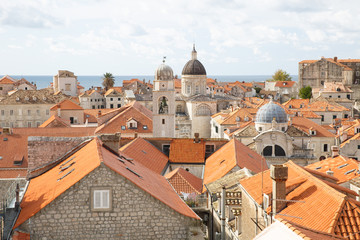 Fototapeta premium Church domes and red roofs of old Dubrovnik, a city on the Adriatic Sea. Croatia