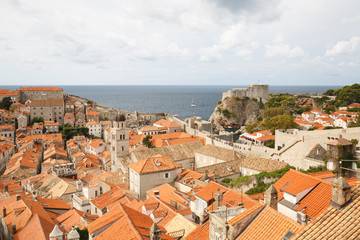 Red roofs of buildings and fortress Lovrijenac from the city walls of Dubrovnik. Croatia