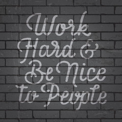 Hand drawn lettering slogan on brick wall background