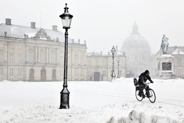 Man on bicycle in winter time