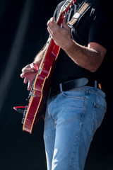Guitar player playing on a concert