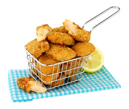 Breadcrumb fried scampi in a small wire frying basket isolated on  a white background