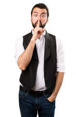 Cool man making silence gesture on isolated white background