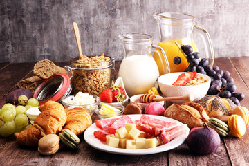 Breakfast served with coffee, orange juice, croissants, cereals