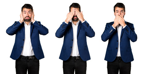 Handsome man covering his eyes, ears and mouth