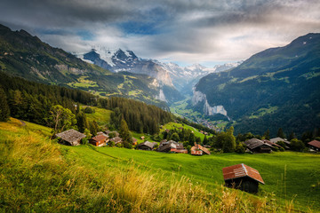 Majestic view of alpine village. Location Swiss alps, Lauterbrunnen valley, Wengen, Europe.