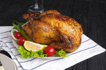 Plate with delicious roasted turkey on table