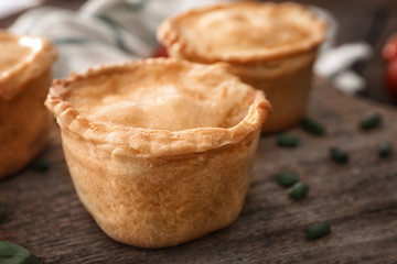 Delicious meat mini pie on board, closeup