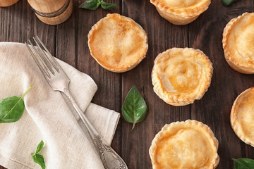 Delicious meat mini pies on table © Africa Studio