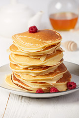Pancakes with raspberry closeup vertical