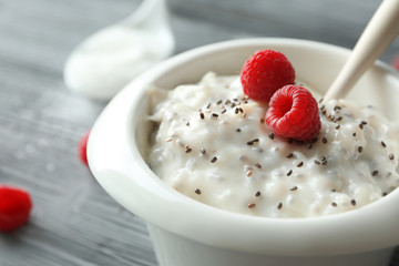 Bowl with delicious chia seed pudding, close up
