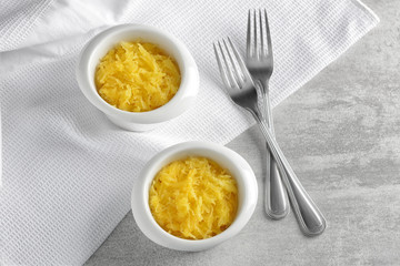 Ramekins with tasty spaghetti squash on table