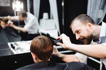 cute young boy getting a haircut