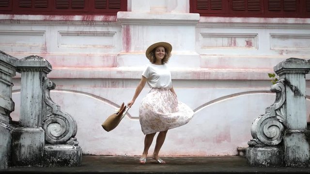 Happy Woman In Light Provence Skirt And Hat Dancing In Old Town. Slow Motion. HD, 1920x1080. 