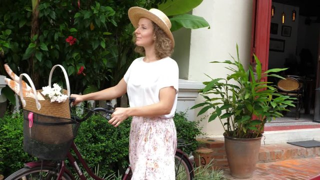 Provence Romantic Woman With Bicycle Walking Near Retro Car On Street. Slow Motion. 4K. 