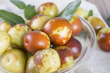 Fresh jujube fruit in a glass bowl.  And closeup.