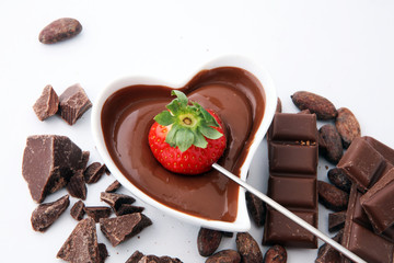 Fondue with Melting chocolate or melted chocolate and strawberry.