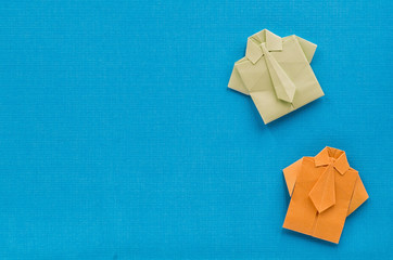 origami paper shirts with ties on textures blue background - obrazy, fototapety, plakaty