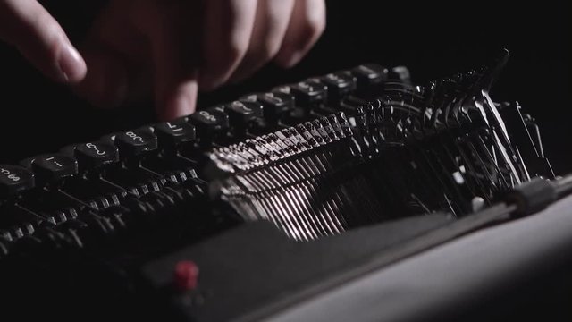 Script writer prints the text on a typewriter