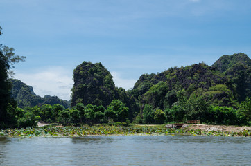 Rowboats transporting tourists in Inland Haolong Bay, Ninh Binh, Vietnam.